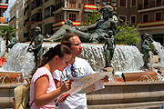 TOURISTS LOOKING AT MAP, PLAZA DE LA VIRGEN, VALENCIA, SPAIN