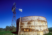 Australian outbacktank, tanks, windmill, windmills, NSW, New South Wales, Australia, sky, skies, blue sky, blue skies, rust, rusty, rusted, rusting, water tank, water tanks, water storage.