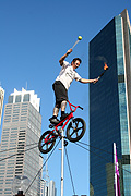 New South Wales, Australia, Sydney, circular quay, performer, performers, acrobat, acrobats, acrobatic, acrobatics, man, men, male, males, balance, balances, balancing, bike, bikes, bicycle, bicycles, transport, transportation, vehicle, vehicles, rope, ropes, juggle, juggles, juggling.