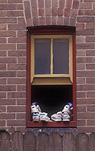 Consumer product, Consumer products, Shoe, Shoes, running shoes, jogging shoes, sport, sports shoes, footwear, window, windows, brick, bricks, brick wall, brick walls, pane, panes, window pane, window panes.
