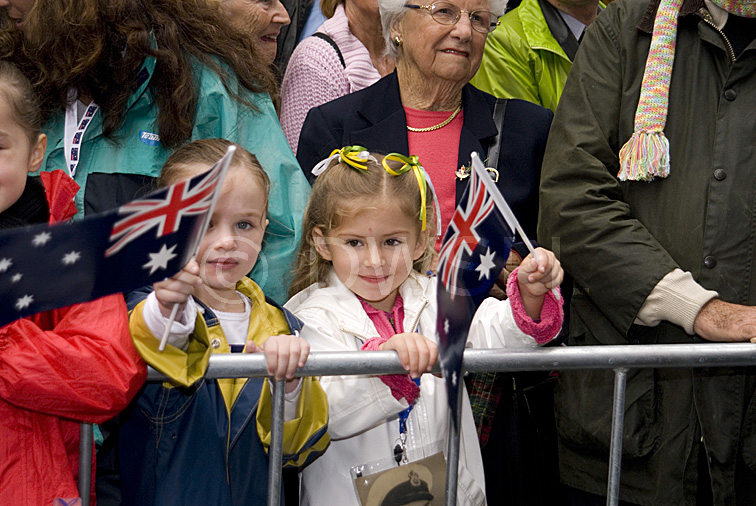 stock photo image: Australia, New South Wales, sydney, anzac, anzacs, anzac day, anzac days, child, children, crowd, crowds, child, children, people, flag, flags, australian, australian flag, australian flags, fence, fences.