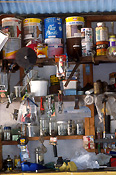 Shed, sheds, tool shed, tool sheds, paint, paints, tin, tins, paint tin, paint tins, tin of paint, tins of paint, jar, jars, glass jar, glass jars, shelf, shelves.
