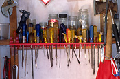 Shed, sheds, tool shed, tool sheds, jar, jars, glass jar, glass jars, shelf, shelves, tool, tools, screwdriver, screwdrivers.