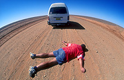 Australia, Australian, Australian desert, Australian deserts, transport, transportation, vehicle, vehicles, van, vans, vehicle, vehicles, number, numbers, number plate, number plates, license plate, license plates, licence plate, licence plates, rego, rego number, rego numbers, registration number, registration numbers, car, cars, road, roads, unsealed, dirt, unsealed road, unsealed roads, dirt road, dirt roads, people, man, men, male, males, body, bodies, corpse, corpses, roadkill, road kill, accident, accidents, road accident, road accidents, people, outback, Australia, australian outbackdesert, deserts, australian, australian desert, australian deserts, man lying, men lying, man lying in road, men lying in road, outdoors.