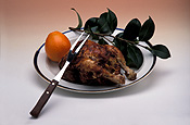 Chicken, chickens, roast chicken, roast chickens, charcoal chicken, charcoal chickets, roast, roasts, food, dinner, dinners, roast dinner, roast dinners, plate, plates, dinner plate, dinner plates, cutlery, fork, forks, orange, oranges, fruit, citrus, citrus fruit, citrus fruits, Royalty Free Image