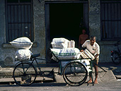 Asia, Asian, Southeast Asia, South East Asian, SE Asia, Malaysia, man, men, male, males, people, outdoors, trishaw, trishaws, transport, transportation, vehicle, vehicles, sack, sacks.