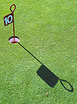 Sport pictures, Sports, golf, golf game, golf games, golf course, golf courses, golf green, golf greens, golfing green, put, puts, putting, grass, green grass, lawn, shadow, shadows, flag, flags, golf hole, golf holes, tenth hole, tenth holes.
