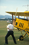 Australia, New South Wales, NSW, vintage plane, vintage planes, biplane, biplanes, bi-plane, bi-planes, transport, transportation, vehicle, vehicles, plane, planes, aircraft, aircrafts, tiger moth, tiger moths, propellor, propellors, man, men, male, males, outdoors, aeroplane, aeroplanes, light, airport, airports, aviaton, tyre, tyres.