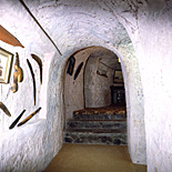 Australia, South Australia, SA, Coober Pedy, dugout, dugouts, house, houses, housing, architecture, underground, arch, arches, archway, archways, boomerang, boomerangs, step, steps, interior, interiors, cave, caves.