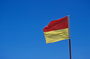 Flag, flags, lifesaving, life saving, life saving flag, life saving flags, lifesaving flag, lifesaving flags, sky, blue sky, blue skies, australia, new South Wales, nsw, beach, beaches, safety, life saver, life savers, caution, livesaving, water safety, safety.