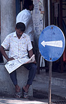 Asia, Asian, Southeast Asia, South East Asian, SE Asia, malaysia, man, men, male, males, read, reading, newspaper, newspapers, paper, sign, signs, arrow, arrows, roadsign, roadsigns, road sign, road signs, arrow, arrows, circle, circles, circular, communications, media.