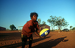 Australia, Anmatyerr, anmatyerr country, community, communities, australian, australian people, child, Children, boy, boys, male, males, teenager, teenagers, teenage boy, teenage boys, aboriginal, aboriginals, aborigine, aborigines, aboriginal child, aboriginal children, aborigine child, aborigine children, indigenous, indigenous people, NY, Yuelamu, Mount Allan, Australia, football, footballs, ball, balls, rugby ball, rugby balls.