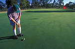 MAN PLAYING GOLF