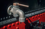 Train, trains, tap, taps, water tap, water taps, old tap, old taps, metal, metal object, metal objects, rail, railway, railways.