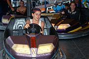 People, steering wheel, steering wheels, child, Children, girl, girls, female, females, bumper car, bumper cars, dodgem, dodgems, dodgem car, dodgem cars, fair, fairs, fairground, fairgrounds, fairground ride, fairground rides, fair ground, fair grounds, fun park, fun parks, funpark, funparks, funfair, funfairs, fun fair, fun fairs, themepark, themeparks, theme park, theme parks, amusement, amusement ride, amusement rides, amusement park, amusement parks, fun spot, fun spots, show, shows, easter show, easter shows, royal easter show, royal easter shows, Australia, New South Wales, sydney.
