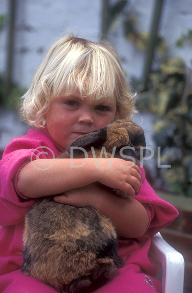 stock photo image: People, child, children, girl, girls, female, females, animal, animals, pet, pets, rabbit, rabbits, hug, hugs, hugging, cuddle, cuddles, cuddling, embrace, embraces, embracing, people and animals, children and animals, people with animals, children with animals, Australia, Sport pictures, Sports, balloon images, hot air balloons