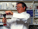 Australia, people, man, men, male, males, chemist, chemists, pharmacist, pharmacists, pharmacy, chemist shop, chemist shops, occupation, occupations, glasses, spectacles, pair of glasses, pair of spectacles, Royalty Free Image