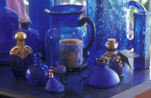 Consumer product, consumer products, glass, glassware, blue glass, blue glassware, bottle, bottles, glass bottle, glass bottles, perfume bottle, perfume bottles, jug, jugs.