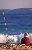 Australia, New South Wales, Sport pictures, Sports, people, woman, women, female, females, fisherman, fishermen, fishing, coast, coasts, coastline, coastlines, water, sea, seas, ocean, oceans, beach, beaches, fishing rod, fishing rods, hat, hats, shoreline, shorelines, seashore, seashores.