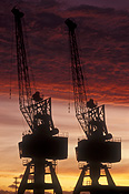Machinery, crane, cranes, silhouette, silhouettes, sunset, sunsets, sunrises and sunsets, industry, construction, construction site, construction sites, building site, building sites, building industry, construction industry.