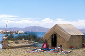 South america, peru, architecture, roof, roofs, rooves, peruvian, titicaca, lake, lakes, lake titicaca, boat, boats, boats, uros floating island, floating islands, house, houses, housing, reed, reeds, reed house, reed houses.