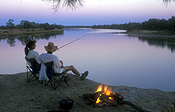Australia, Sport pictures, Sports, fishing, water, river, rivers, albert river, qld, queensland, fishing rod, fishing rods, DFF, DFFWATERRES, camp, camps, camping, camp fire, campfire, campfires, camp fires, fire, fires, people, couple, couples, man, men, male, males, female, females, people, woman, women, flame, flames.