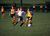 People, child, children, puberty, Sport pictures, Sports, football, footballs, outdoors, football game, run, runs, running, football games, ball, balls, teenager, teenagers, teenage boy, teenage boys, boy, boys, male, males, uniform, uniforms, adolescent, adolescents, outdoors.