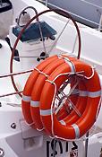 Transport, transportation, vehicle, vehicles, boat, boats, boating, lifesaving, lifesaving equipment, lifesaving ring, lifesaving rings, steering wheel, steering wheels, circle, circles, circular.