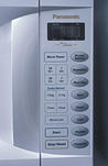 Consumer product, consumer products, kitchen appliance, kitchen appliances, microwave oven, microwave ovens, microwave, microwaves, oven, ovens, clock, clocks, digital clock, digital clocks, time, time-keeping, panasonic, cook, cooks, cooking, whitegoods, appliance, appliances, electric, electric goods, Royalty Free Image