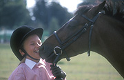 People, outdoors, child, Children, female, females, girl, girls, people and animals, children and animals, people with animals, children with animals, Animal, Animals, Horse, horses, bridle, bridles, hat, hats, laugh, laughs, laughing, laughter, smile, smiles, smiling, happy, happiness, Australia, Sport pictures, Sports, balloon images, hot air balloons