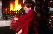 People, child, children, boy, boys, male, males, indoors, fire, fires, flame, flames, present, presents, gift, gifts, christmas, present, presents, AM04,