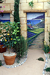 Garden, gardens, courtyard, courtyards, courtyard garden, courtyard gardens, wall, walls, mural, murals, wall mural, wall murals, painting, paintings, wall painting, wall paintings, pot, pots, garden pot, garden pots, outdoor pot, outdoor pots, citrus, lemon, lemons, lemon tree, lemon trees, terracotta, terracotta pot, terracotta pots, gravel, fruit tree, fruit trees.