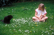 Australia, people, child, children, girl, girls, female, females, cat, cats, domestic, domestic cat, domestic cats, lawn, lawns, outdoors.