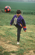 People, child, children, boy, boys, male, males, football, footballs, kick, kicks, kicking, ball, balls, outdoors, soccer, soccer ball, soccer balls, Australia, Sport pictures, Sports, balloon images, hot air balloons