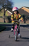 People, child, children, female, females, girl, girls, child riding bicycle, bicycles, children riding bicycles, bicycle, bicycles, transport, transportation, vehicle, vehicles, bike, bikes, cycle, cycles, cycling, bike riding, bicycle riding, helmet, helmets, child safety, bicycle helmet, bicycle helmets, bike helmet, bike helmets, safety gear, knee pad, knee pads, knee-pad, knee pads, Australia, Sport pictures, Sports, balloon images, hot air balloons