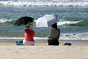 Australia, qld, queensland, surfers, surfers paradise, gold coast, beach, beaches, coast, coasts, coastal, coastline, coastlines, woman, women, female, females, umbrella, umbrellas.