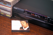 Consumer product, consumer products, cd player, cd players, cd disc, cd discs, cd, cds, music, entertainment, disc, discs, disk, disks, singer, singers, man, men, male, males.