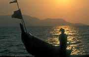 Asia, Asian, Southeast Asia, South East Asian, SE Asia, malaysia, archipelago, archipelagos, andaman, andaman sea, langkawi, fishing boat, fishing boats, boat, boats, flag, flags, langkawi, fishermen, fisherman, fishing, silhouette, silhouettes, sunset, sunsets, sunrises and sunsets, mood, mood scene, mood scenes, sunset, langkawi island, pulau lagenda, legendary island, coast, coasts, coastline, coastlines.