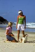 Australia, New South Wales, beach, beaches, coast, coasts, sand, coastline, coastlines, shoreline, shorelines, cavalier, cavaliers, water, cavalier king charles, cavalier king charles spaniel, cavalier king charles spaniels, seashore, seashores, people, child, children, puberty, teenager, teenagers, teenage girl, teenage girls, adolescent, adolescents, female, females, Animal, Animals, dog, dogs, mammal, mammals, placental mammal, placental mammals, carnivore, carnivores, pet, pets, domestic animal, domestic animals, domestic dog, domestic dogs, spaniel, spaniels, king charles spaniel, king charles spaniel, puppy, puppies, young animal, young animals, baby animal, baby animals, cute animal, cute animals, walk, walks, walking, outdoors, sunburn, hat, hats, Royalty Free Image