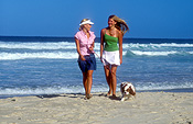 Australia, New South Wales, beach, beaches, coast, sand, coasts, coastline, coastlines, shoreline, shorelines, water, cavalier, cavaliers, cavalier king charles, cavalier king charles spaniel, cavalier king charles spaniels, seashore, seashores, people, child, children, puberty, teenager, teenagers, teenage girl, teenage girls, adolescent, adolescents, female, females, Animal, Animals, dog, dogs, mammal, mammals, placental mammal, placental mammals, carnivore, carnivores, pet, pets, domestic animal, domestic animals, domestic dog, domestic dogs, spaniel, spaniels, king charles spaniel, king charles spaniel, puppy, puppies, young animal, young animals, baby animal, baby animals, cute animal, cute animals, walk, walks, walking, outdoors, sunburn, hat, hats, Royalty Free Image