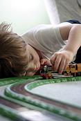 Child, children, girl, girls, female, females, male, males, boy, boys, train, trains, train set, train sets, indoors, track, tracks, train track, train tracks, PJ38,