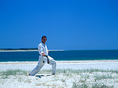 People, man, men, male, males, outdoors, karate, Sport pictures, Sports, beach, beaches, coast, coasts, coastline, coastlines, seashore, seashores, shoreline, shorelines, uniform, uniforms, exercise, exercises, exercising, qld, queensland, australia, martial arts.