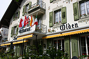 Europe, Switzerland, Swiss, Gstaad, architecture, restaurant, restaurants, flag, flags, balcony, balconies, shutter, shutters, window, windows.