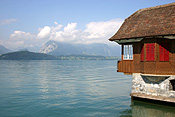Europe, Switzerland, Swiss, Interlaken, lake, lakes, thun, lake thun, water, roof, roofs, rooves, house, houses, housing, architecture, window, windows, shutter, shutters.
