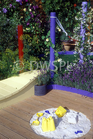 stock photo image: Garden, gardens, deck, decks, decking, timber, timber deck, timber decks, wood, wooden, wooden deck, wooden decks, wooden decking, sandpit, sandpits, sand pit, sand pits, toys, bucket, buckets.